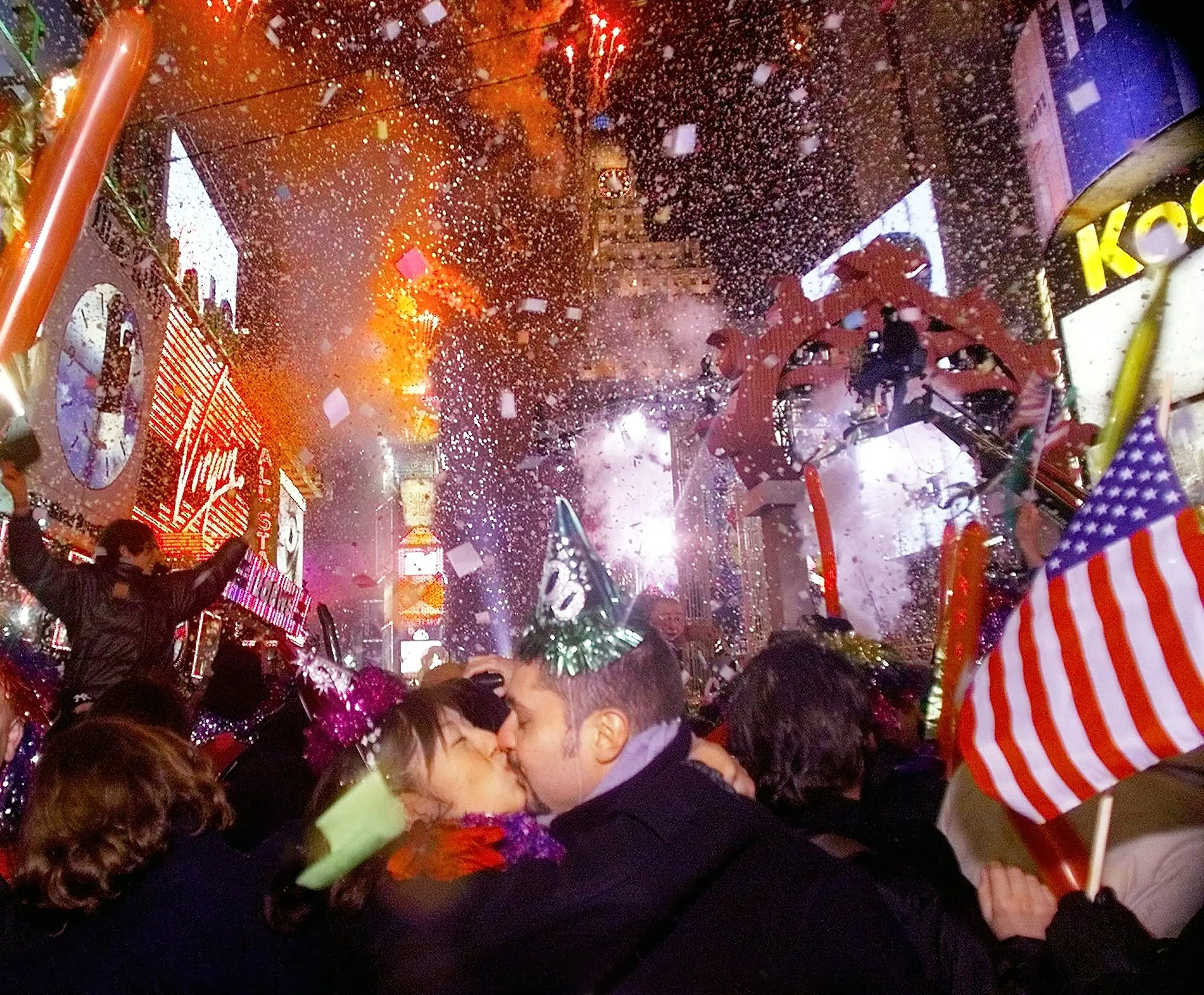 Y2K Kiss — Mizumi Malfitamo kisses her husband Francesco as they celebrate the arrival of a new millennium in New York City's Times Square seconds after midnight Saturday, January 1, 2000. The Malfitamos, Italian tourists, chose to usher in the uncertainty of the new millennium under the lights on Broadway.  (AP Photo/Stephan Savoia)  © The Associated Press