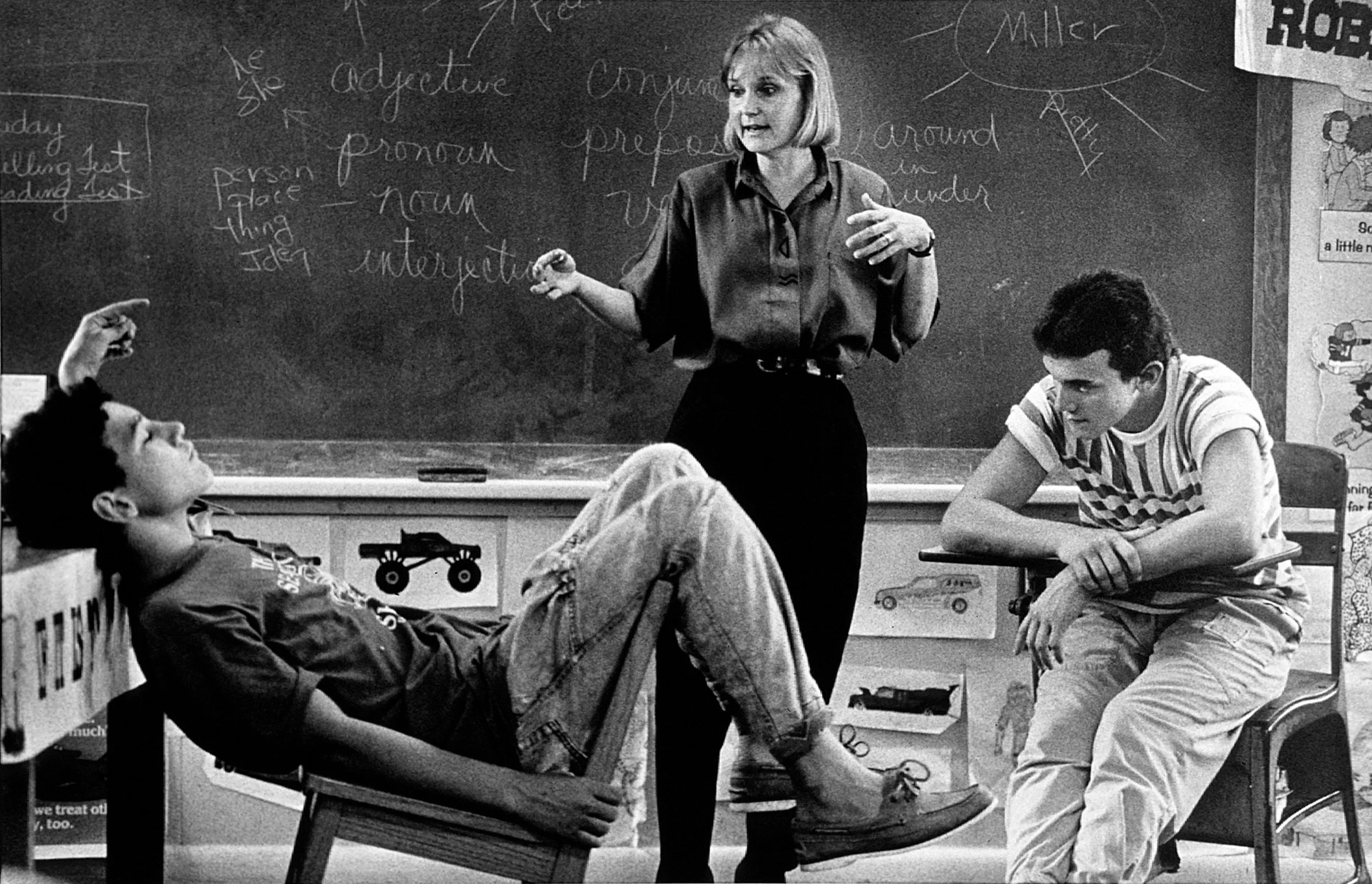 Not Feel'in It — "Operation Rescue" teacher Maxine Miller discusses a reading assignment with Michael McNair, 15, leaning back in his chair, as fellow student Robert Bonnette, 15, pays close attention. The Baton Rouge school district's Operation Rescue program was set up to address the plight of students at risk who are not successfully meeting their educational needs. Circa 1989.  (Photo by Stephan Savoia)  © Stephan Savoia