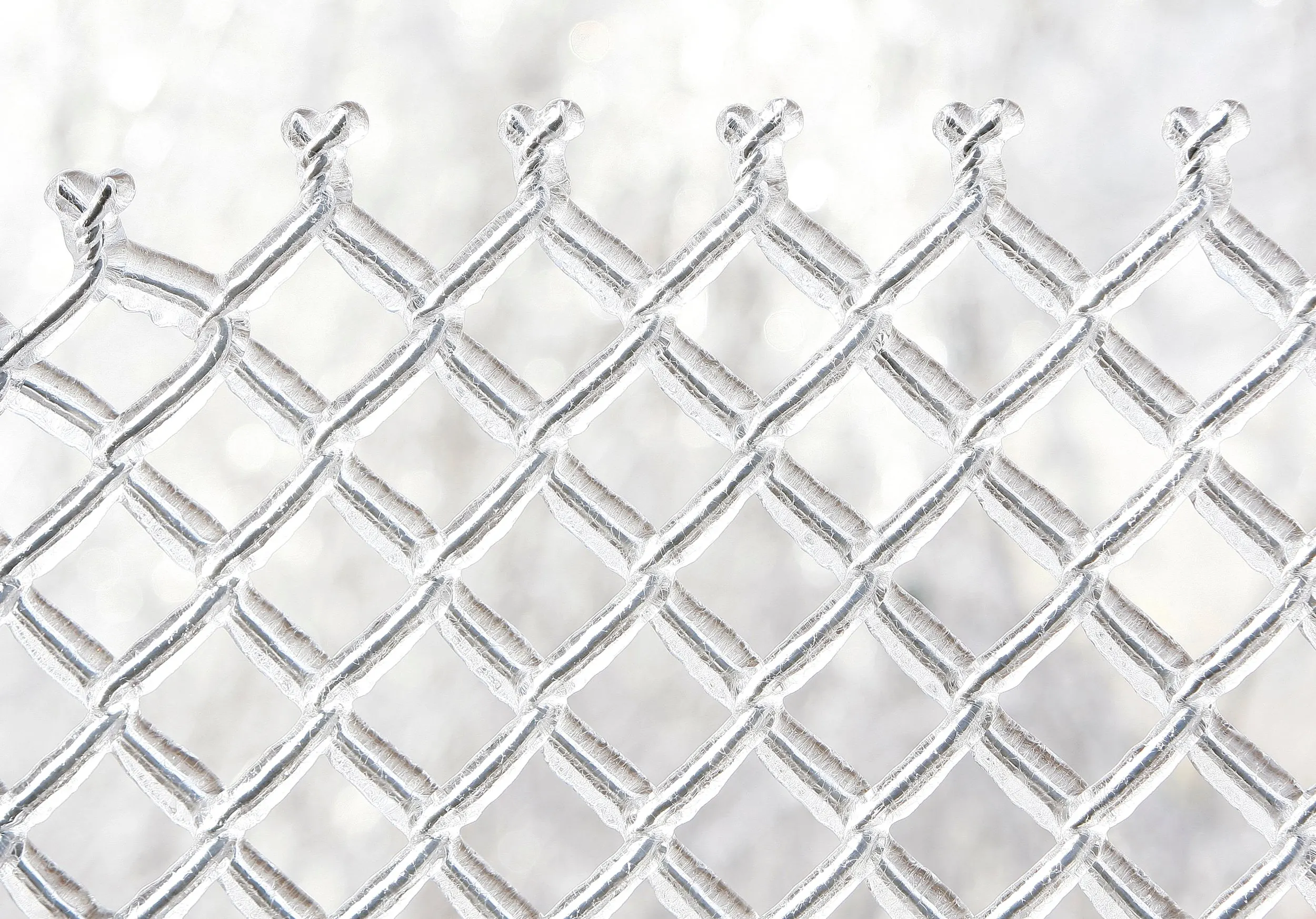 Ice Storm Aftermath — A chain-link fence is coated in a thick layer of ice in the aftermath of an ice storm along Route140 in Boylston, Massachusetts, on Friday morning, December 12, 2008.  (AP Photo/Stephan Savoia)  © The Associated Press