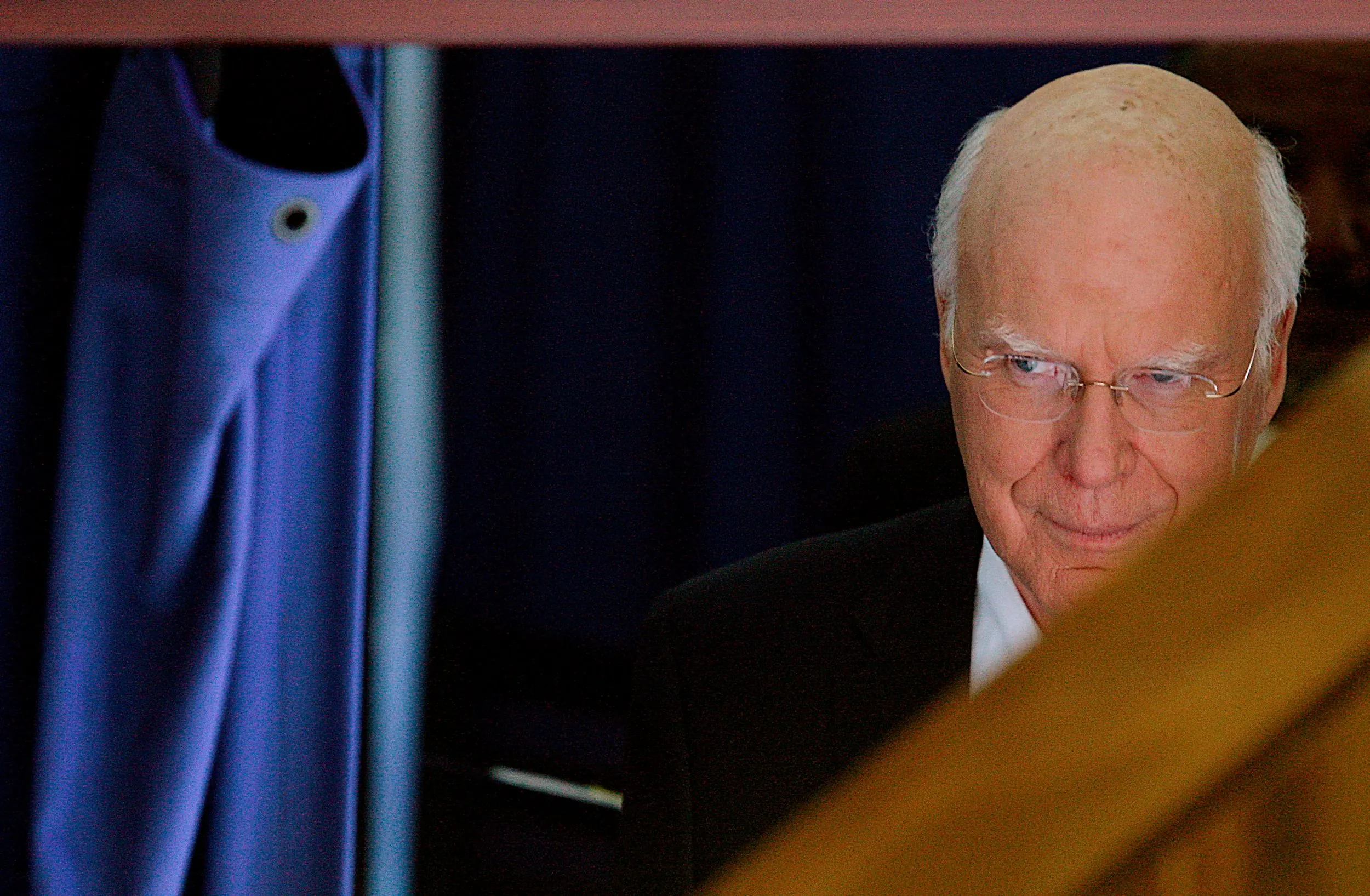 Up Next — United States Senator Patrick Leahy, Democrat from Vermont, peers out from behind a curtain before walking on stage and taking the podium to address the Democratic National Convention in support of presidential candidate Barack Obama in Denver, Colorado, on Tuesday evening, August 26, 2008.  (AP Photo/Stephan Savoia)  © The Associated Press