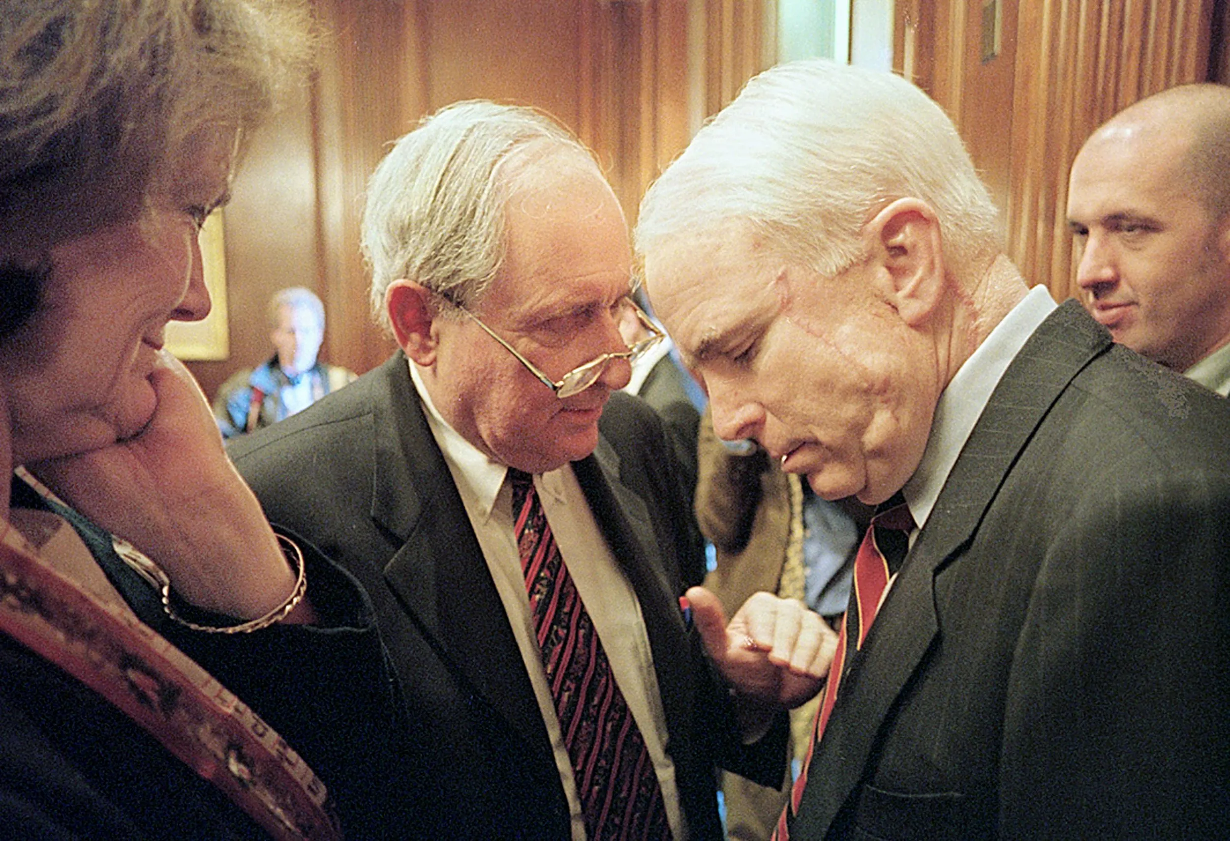 Across The Aisle Agreement — U.S. Senator John McCain, Republican Arizona, center right, huddles with Senator Carl Levin, Democrat Michigan, to discuss strategy at the conclusion of the daily member’s meeting in the Mansfield room near the United States Senate floor on Monday morning, March 26, 2001 on Capitol Hill in Washington, D.C. The members meeting is a daily meeting of campaign finance reform supporters where they discuss the coming day's tactics. At right, Mark Buse, McCain's lead advisor for the McCain/Feingold campaign finance reform bill, looks on with one of Levin's aides at left.  (AP Photo/Stephan Savoia)  © The Associated Press