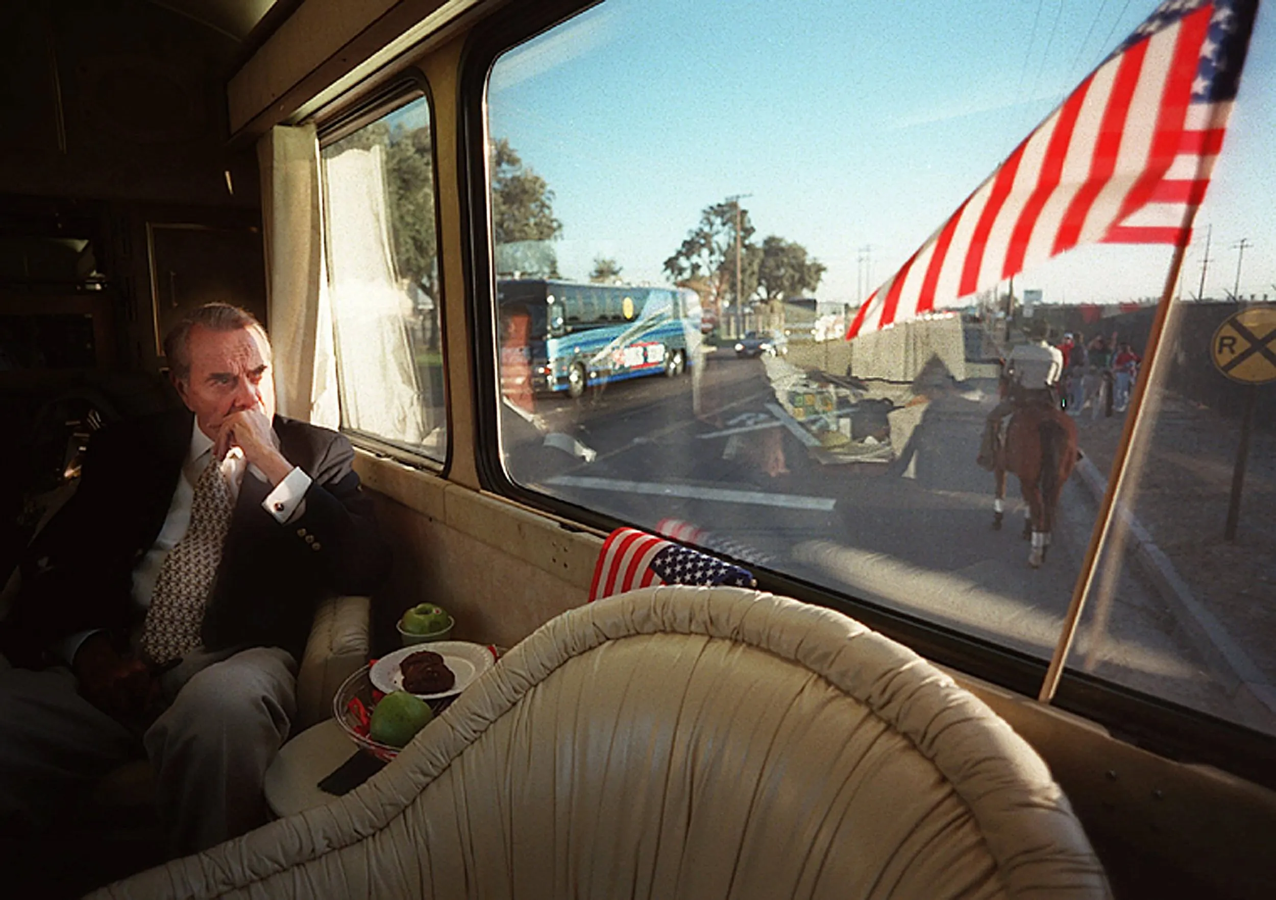 Reckoning With Reality — Pulling into his seventh stop of the day, Republican Presidential candidate and former U.S. Senate Majority Leader Bob Dole, Kansas, looks out a back window of his campaign bus as he arrives at his final rally of the day in Stockton, California Saturday, October 26, 1996. Dole lost his bid for the presidency in a landslide defeat to President Bill Clinton 10 days later.  (AP Photo/Stephan Savoia)  © The Associated Press