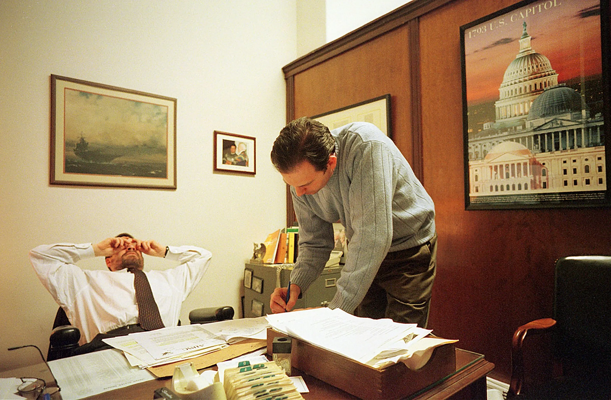 Where The Sausage Is Made — Mark Salter, chief-of-staff for U.S. Senator John McCain, Republican Arizona, rubs his eyes as McCain's political advisor John Weaver, right, looks over some papers in Salter's office on Capitol Hill Wednesday afternoon, March 21, 2001 in Washington, D.C. McCain was on the Senate floor taking part in the third day of debate over his campaign finance reform bill.  (AP Photo/Stephan Savoia)  © The Associated Press